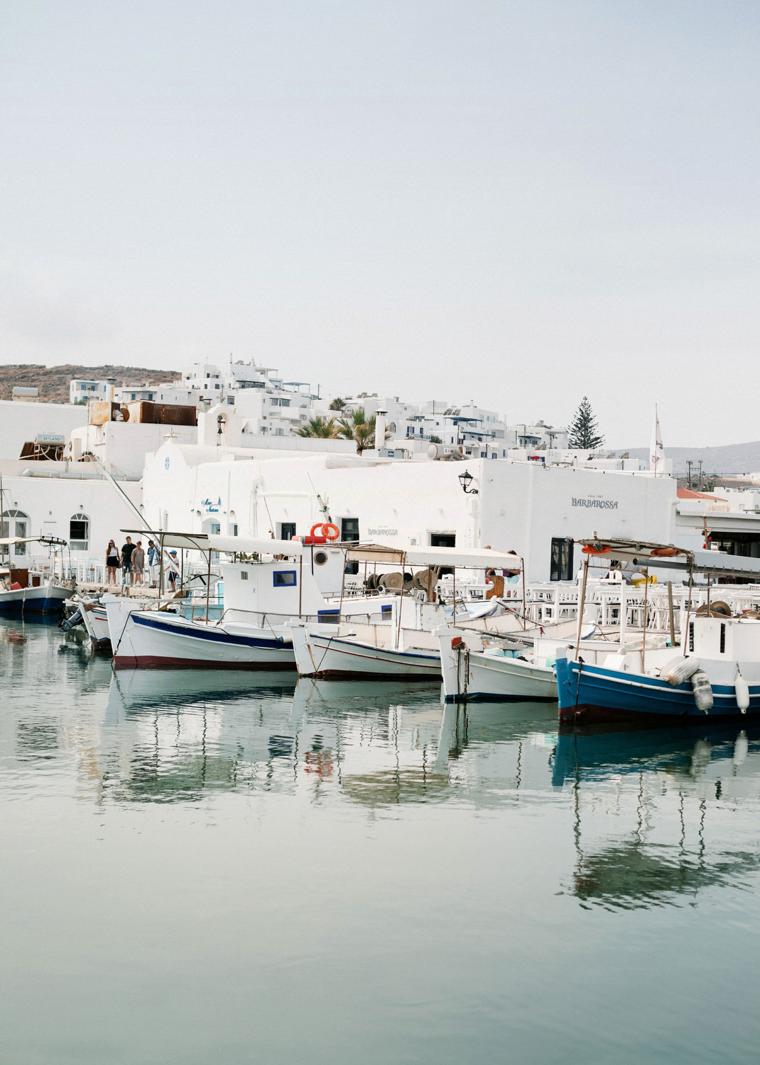 Stunning Paros destination wedding in Cycladic villa with blue and red decor