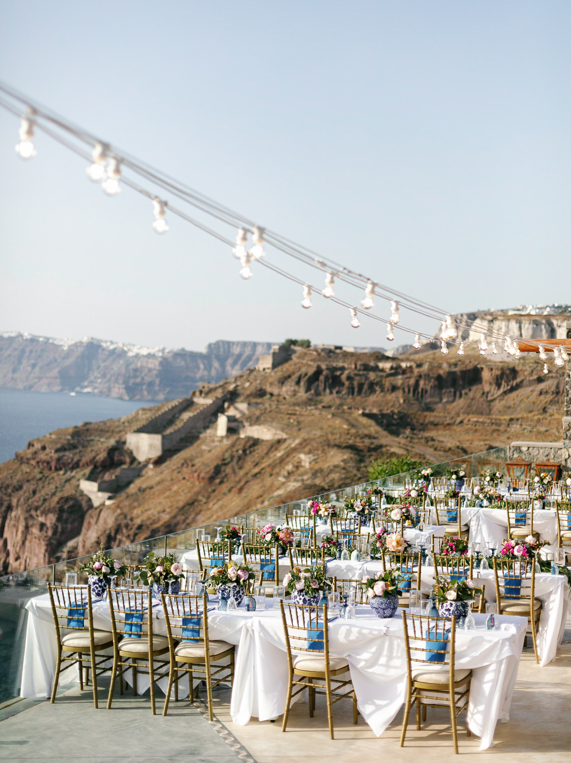 A stunning table setup with floral centerpieces and elegant tableware at an outdoor reception