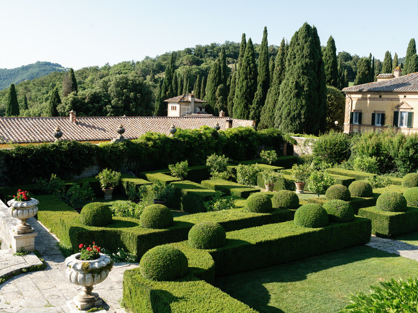 Manicured Italian gardens and historic villa at La Foce in Tuscany set for a refined destination wedding