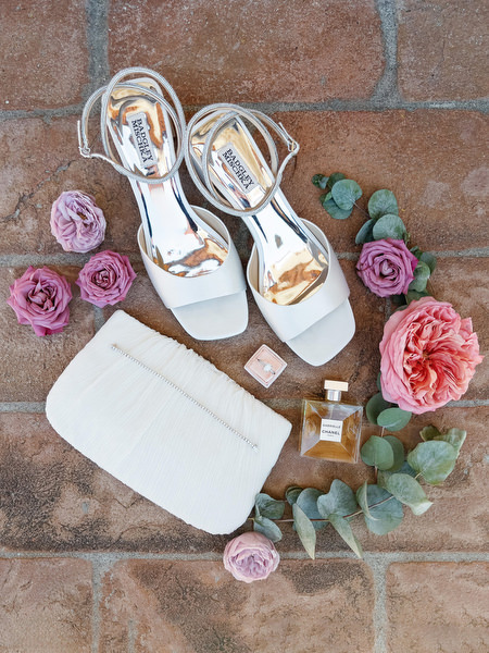 Bridal details including heels and perfume at Villa Corsini, luxury Tuscany wedding in Florence.