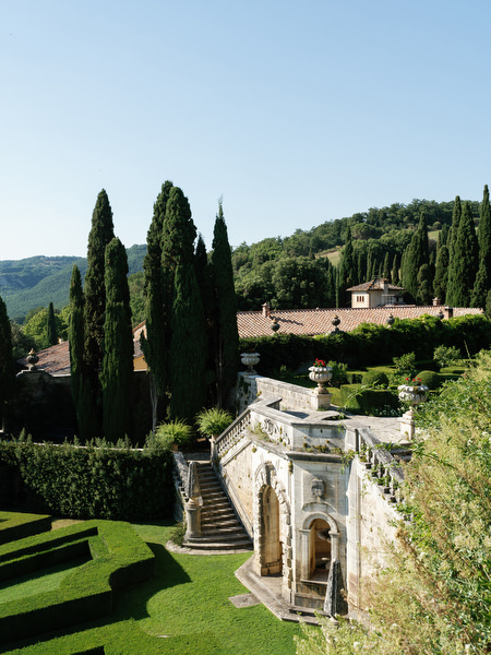 Cypress-lined terraces and historic stone architecture at La Foce wedding venue in Tuscany