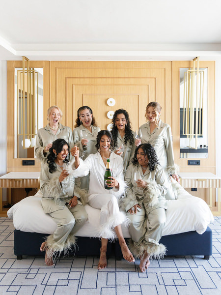Champagne celebration during bridal preparations for an Indian destination wedding at Grand Hyatt Athens
