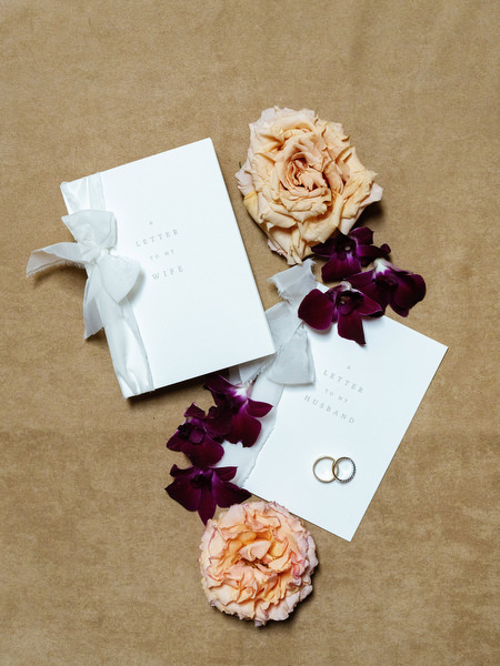 Luxury wedding invitation suite with silk ribbon and peach florals styled for a Tuscany destination wedding at La Foce