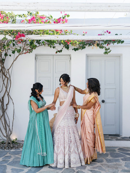 Bride getting ready with family in a pastel lehenga during a three-day Indian wedding at Island Resort The Residence on the Athens Riviera