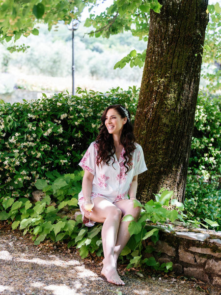 Bride relaxing in Villa Corsini gardens before her Florence Jewish wedding in Tuscany.