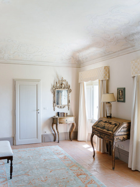 Elegant bridal suite interior at La Foce estate featuring frescoed ceilings and classic Tuscan architecture