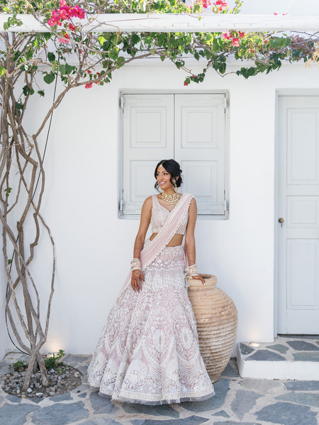 Full-length bridal portrait in blush lehenga at Island Resort The Residence during a destination Indian wedding in Athens