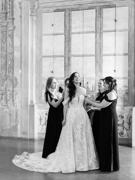 Bridesmaids helping bride at Villa Corsini, elegant Jewish wedding preparation in Florence, Tuscany.