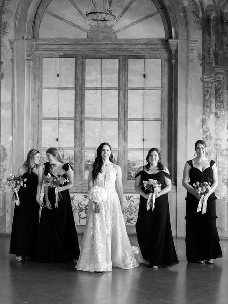 Bride and bridesmaids inside Villa Corsini, historic Tuscan villa wedding in Florence, Italy.