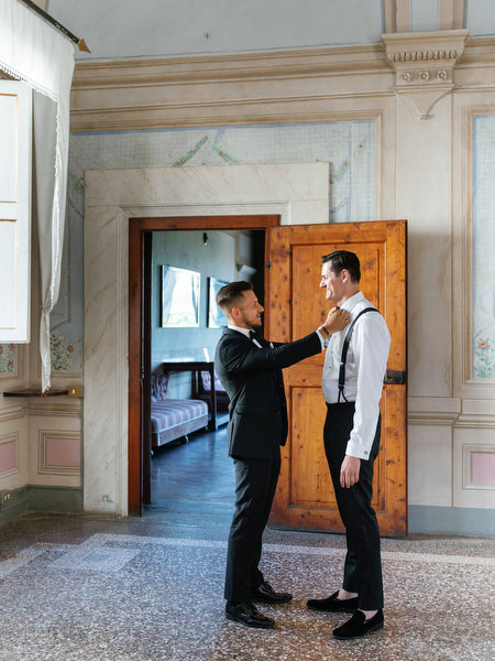 Groom getting ready inside Villa Corsini a Mezzomonte, luxury Jewish wedding venue in Florence, Tuscany.