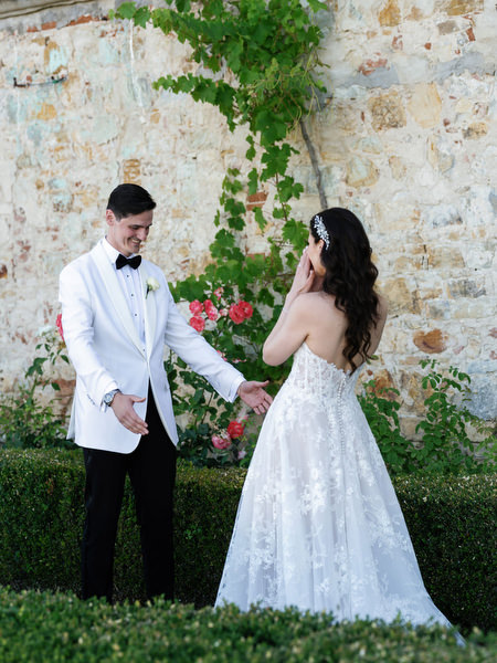 Bride and groom first look at Villa Corsini a Mezzomonte, elegant Tuscan villa wedding in Florence.
