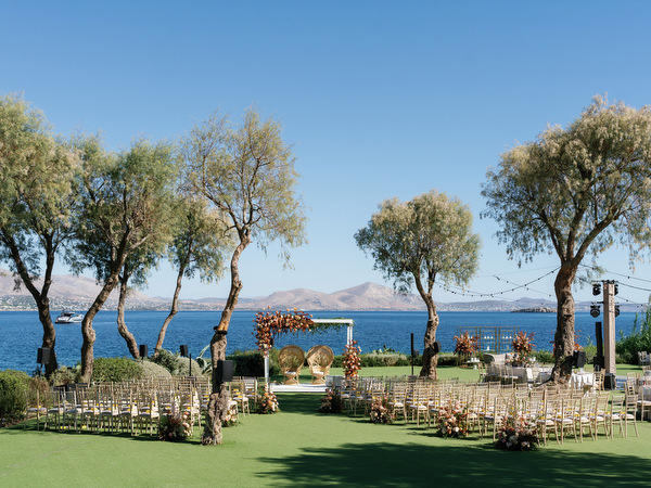 Seaside ceremony setup overlooking the Aegean at Island Resort the Residence during a luxury Indian wedding on the Athens Riviera