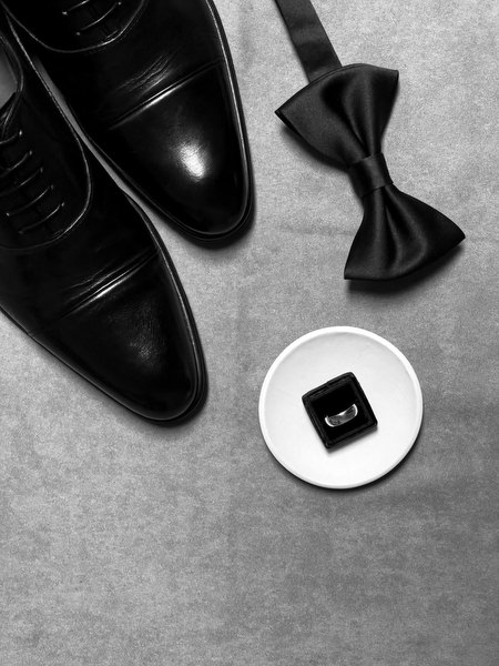 Black patent leather shoes and bow tie styled for an elegant destination wedding in Tuscany