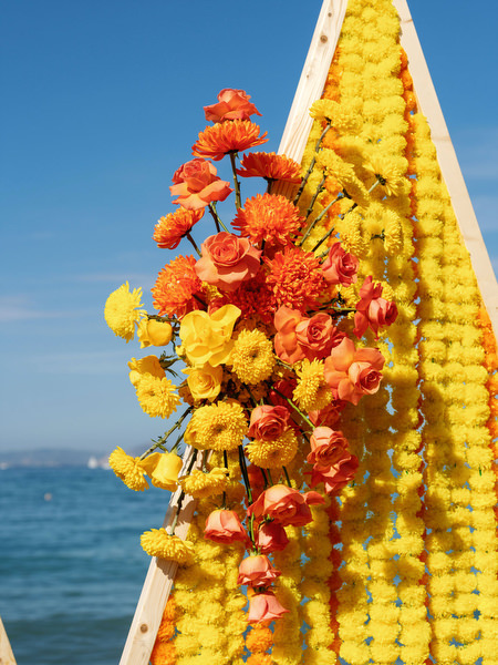 Floral yellow Haldi ceremony backdrop at Rubirosa beach venue