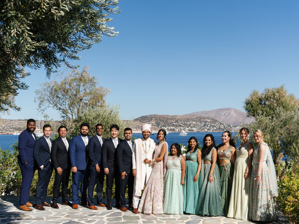 Full wedding party portrait overlooking the Athens Riviera at Island Resort the Residence