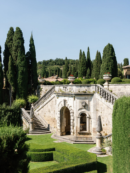Historic stone staircase and terraces at La Foce, an iconic destination wedding venue in Tuscany