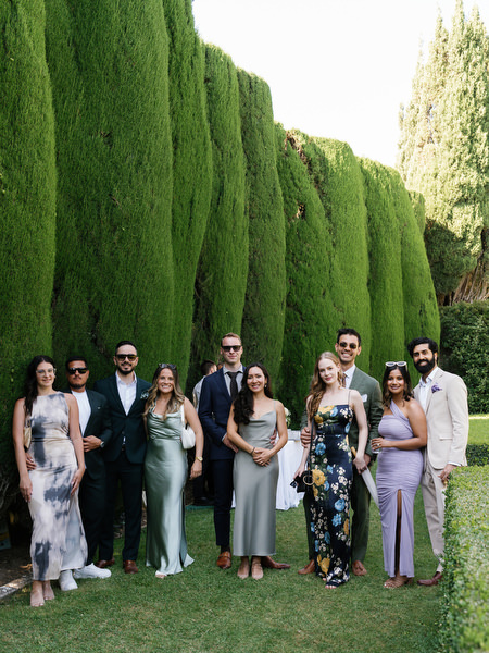Friends gathered for group portrait at La Foce during luxury Tuscany wedding celebration