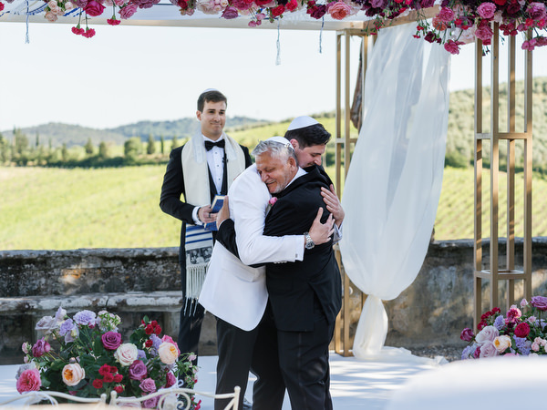 Emotional moment under chuppah at Villa Corsini a Mezzomonte, luxury Jewish wedding in Florence.