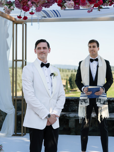 Groom awaiting bride under chuppah at Villa Corsini, Florence Jewish wedding in Tuscany.