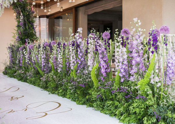 Lavish purple and green floral aisle installation at a couture Athens wedding at Island Resort Athens Riviera