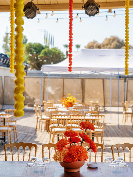 Decorated Haldi ceremony table with ocean view in Greece