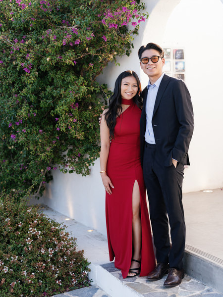 Couple posing near bougainvillea at Island Resort the Residence on the Athens Riviera