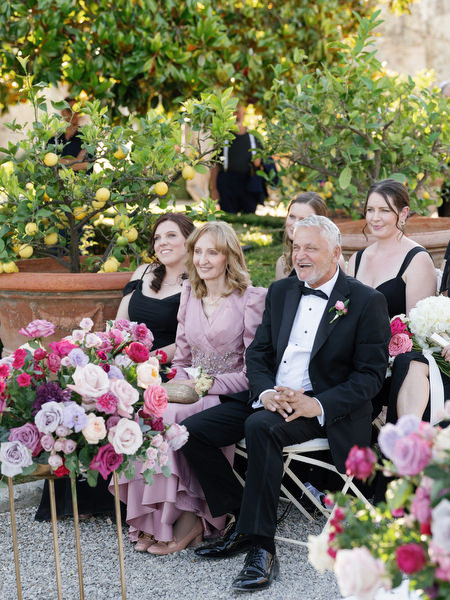 Family watching chuppah ceremony at Villa Corsini, luxury Jewish wedding in Florence, Tuscany.