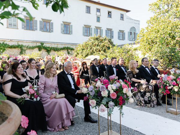 Wedding guests at Jewish ceremony in Villa Corsini gardens, Tuscany wedding in Florence.