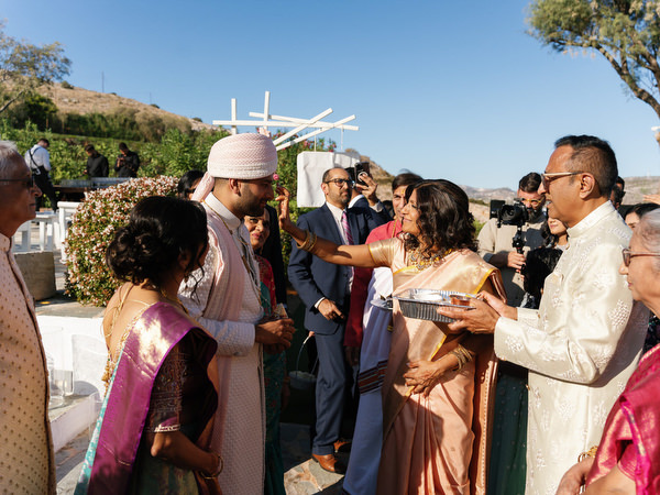 Welcoming ritual during a luxury Indian wedding at Island Resort the Residence, Greece