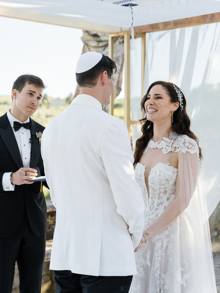 Joyful moment under chuppah at Villa Corsini, luxury Jewish wedding in Florence.