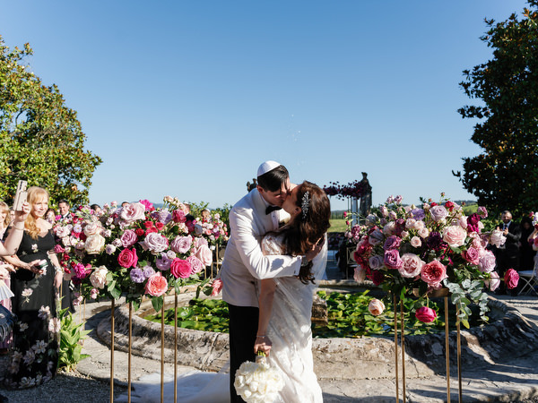 First kiss at Jewish wedding at Villa Corsini, luxury Florence wedding in Tuscany.