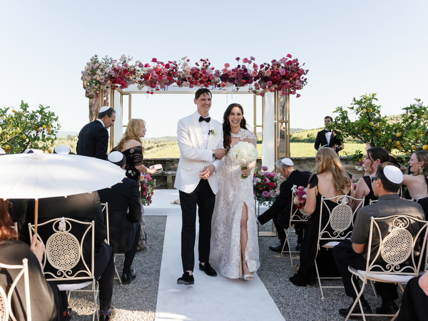 Newlyweds recessional at Villa Corsini a Mezzomonte, elegant Jewish wedding in Florence, Tuscany.