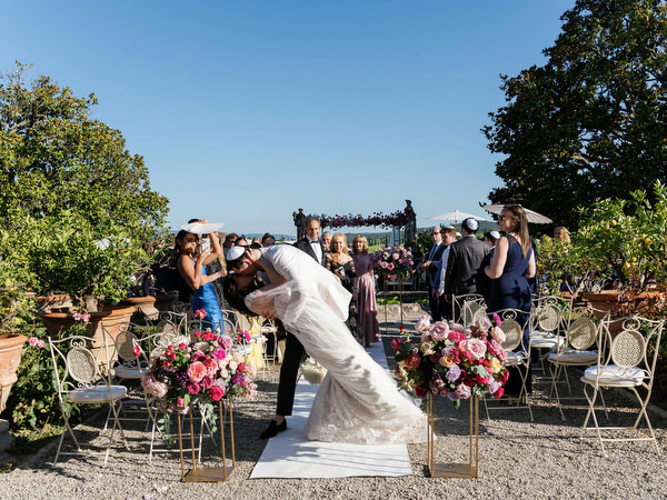 Kiss at Jewish wedding at Villa Corsini, luxury Florence wedding in Tuscany.