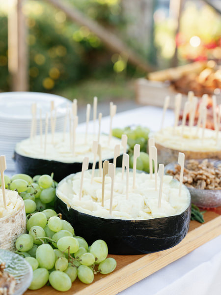 Cheese and grapes display at Tuscany wedding welcome dinner