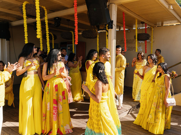Guests arriving to beach Haldi ceremony at Rubirosa