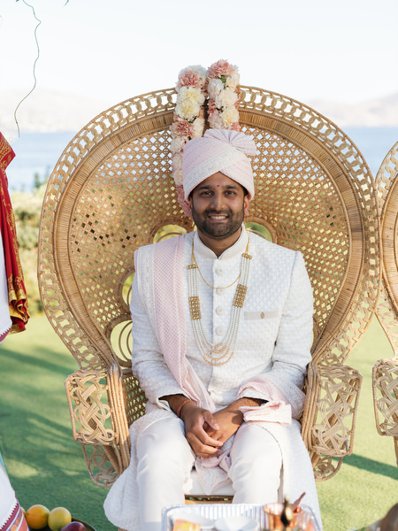 Groom seated on decorative mandap chair during the Hindu ceremony at Island Resort the Residence