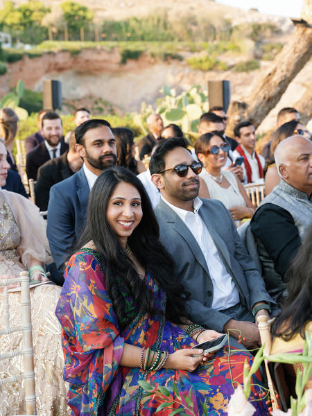 Guests smiling during the Indian wedding ceremony at Island Resort the Residence, Greece