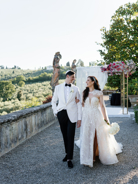 Bride and groom overlooking Tuscan countryside at Villa Corsini a Mezzomonte, Florence wedding.