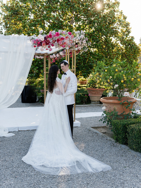 Romantic portrait at Villa Corsini chuppah, luxury Jewish wedding in Florence, Tuscany.