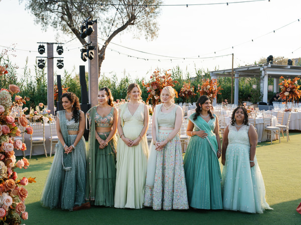 Bridesmaids lined up on the ceremony lawn at Island Resort the Residence on the Athens Riviera