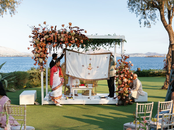 Sacred Hindu wedding ritual taking place beneath floral mandap at Island Resort the Residence