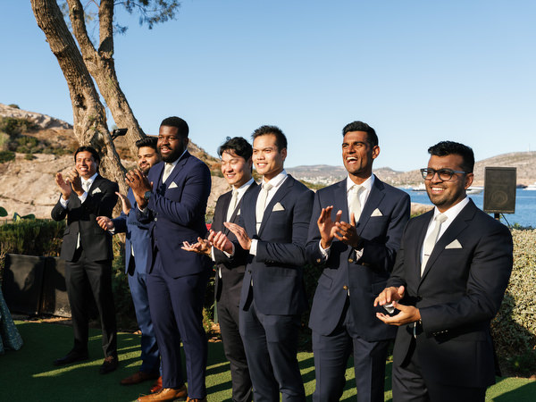 Groomsmen applauding during the Indian wedding ceremony at Island Resort the Residence