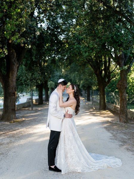 Romantic portrait beneath Tuscan trees at Villa Corsini a Mezzomonte, Florence Jewish wedding.