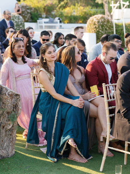 Guests watching the ceremony at Island Resort the Residence during a luxury Indian wedding in Athens