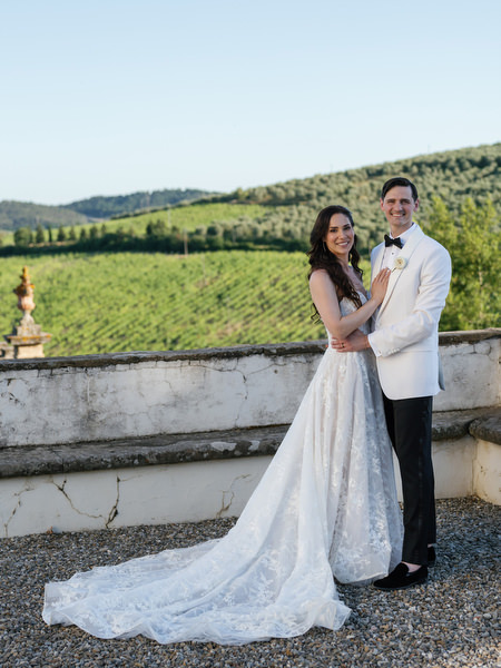 Newlyweds overlooking Tuscan countryside at Villa Corsini, luxury Jewish wedding in Florence.