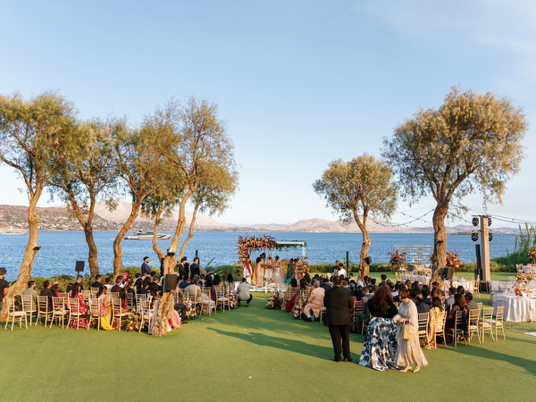 Wide ceremony view overlooking the Aegean Sea at Island Resort the Residence during an Indian wedding in Athens