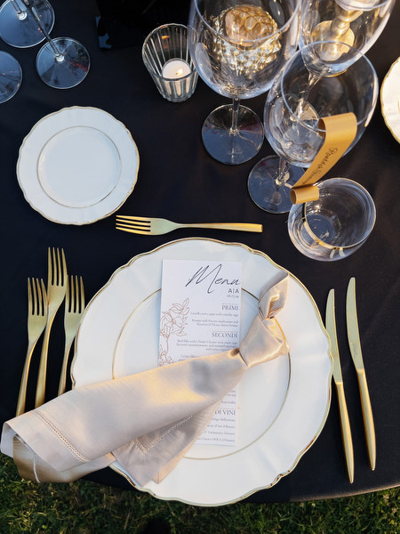 Luxury wedding place setting with gold flatware and printed menu at Villa Corsini a Mezzomonte, Florence wedding.