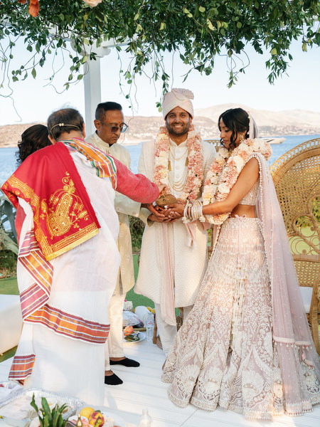 Sacred hand ritual during an Indian wedding at Island Resort the Residence