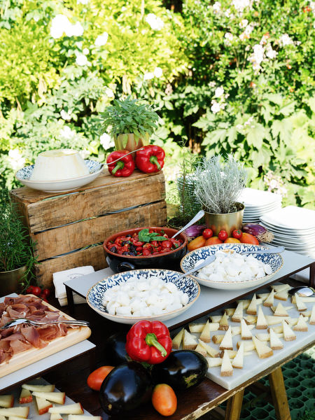 Elegant Italian antipasti display with cheeses, vegetables, and charcuterie at luxury Tuscany wedding