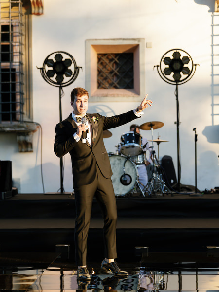 Groomsman giving speech on stage at Villa Corsini a Mezzomonte, luxury Jewish wedding reception in Florence.